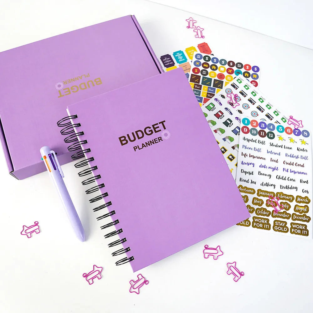 Purple A4 coil notebook for financial planning with budget pages, pen and accessories