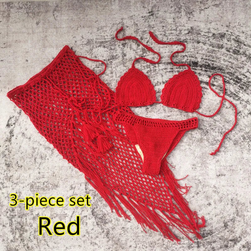 Women's white handmade crochet bikini swimsuit set with a separate matching skirt.