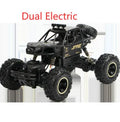 Large black 4WD remote control off-road climbing car on rough ground