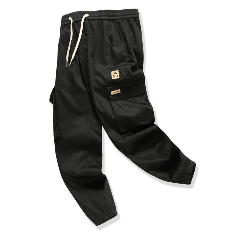 Men's multi bag pants in black, loose fit with multiple pockets, 80% polyester casual trousers