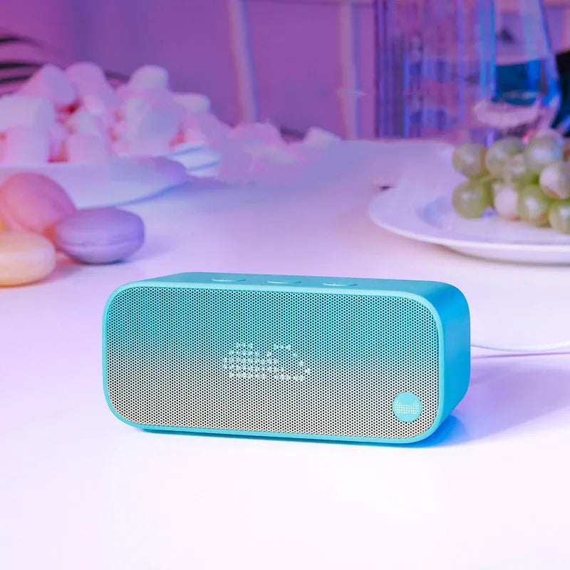 Elf Sugar Cube AI Wi-Fi speaker set in blue, green, red, or white colours for bookshelf placement
