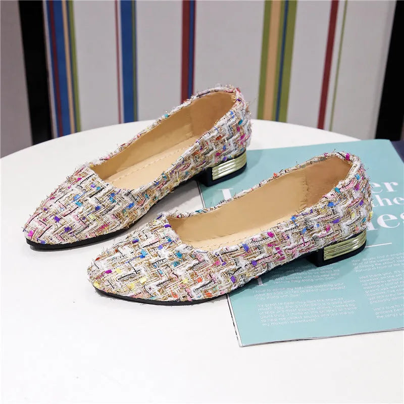 Women's black canvas casual flats with pointed toe and low-cut design on flat rubber sole