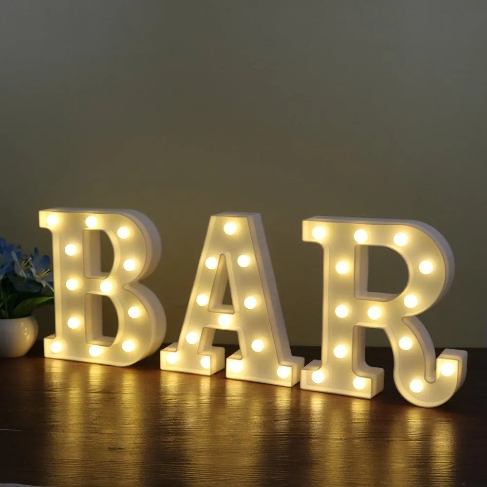 White plastic LED marquee letter sign with warm white glow, 22cm tall