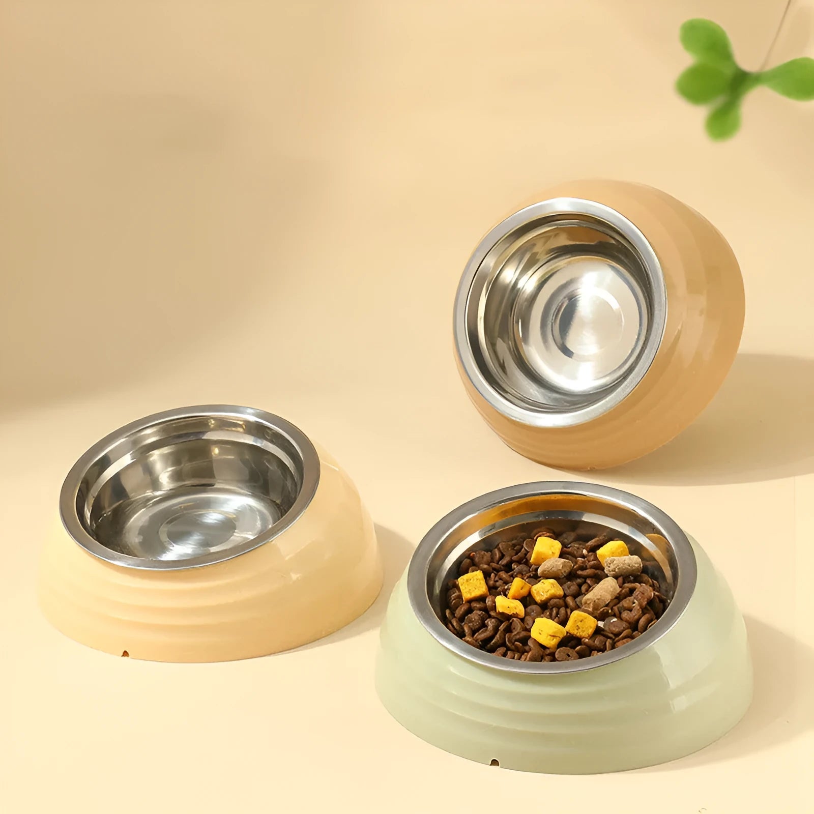 Stainless steel cat bowl with plastic base in light green, beige, and brown colour options