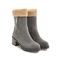 Black waterproof rubber snow boots with a thick sole and plush lining.