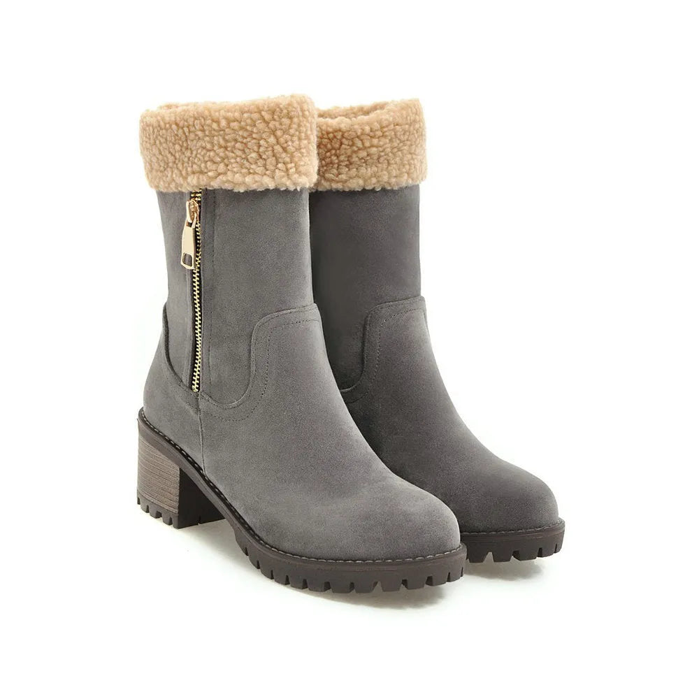Black waterproof rubber snow boots with a thick sole and plush lining.