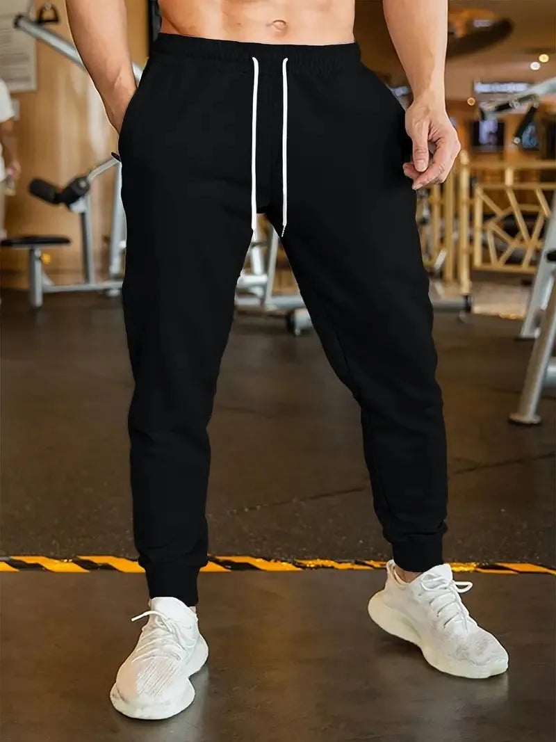 Men's thin polyester leisure trousers with an elastic drawstring waist in a loose fit style