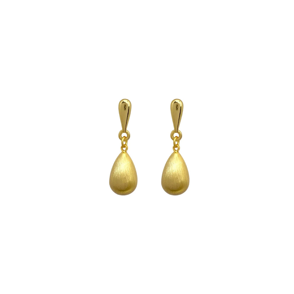 Close-up of wire drawing drop pendant ear clips in geometric teardrop shape, copper with gold electroplated finish