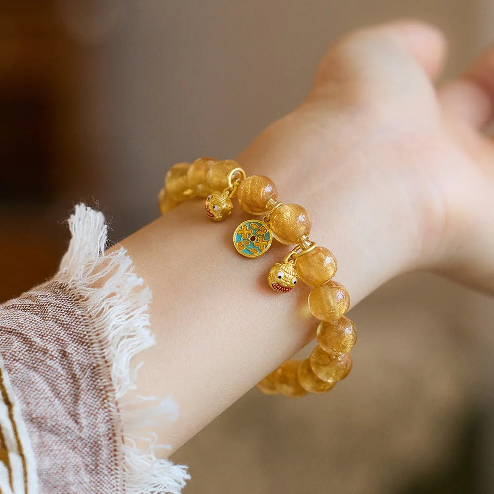 Handmade national style bracelet with gold foil coloured glaze swallowing gold beast charm