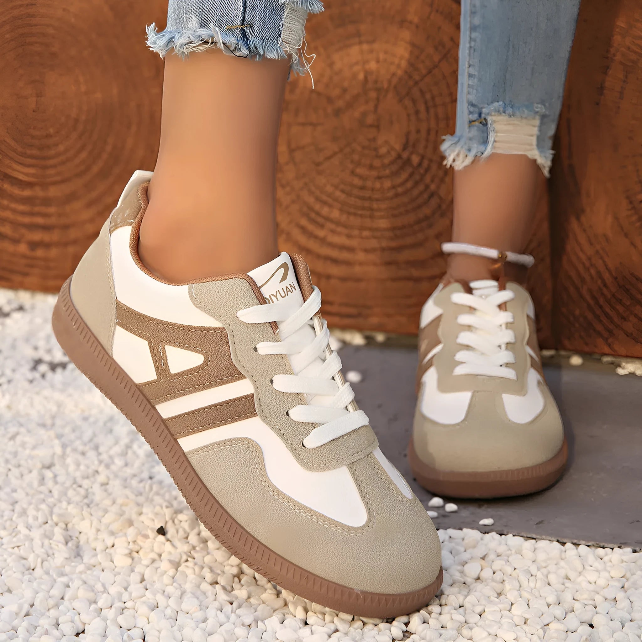 Women's retro colour matching lace-up jogging shoes in black, showing low-top design and platform heel.