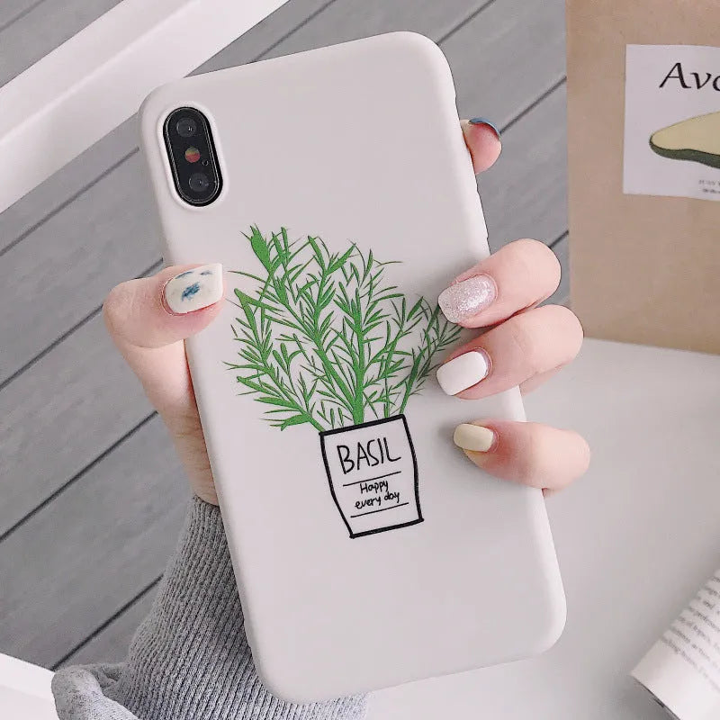 White silicone iPhone case with a detailed painted plant design on the back, showing the smooth texture and enclosed edges.