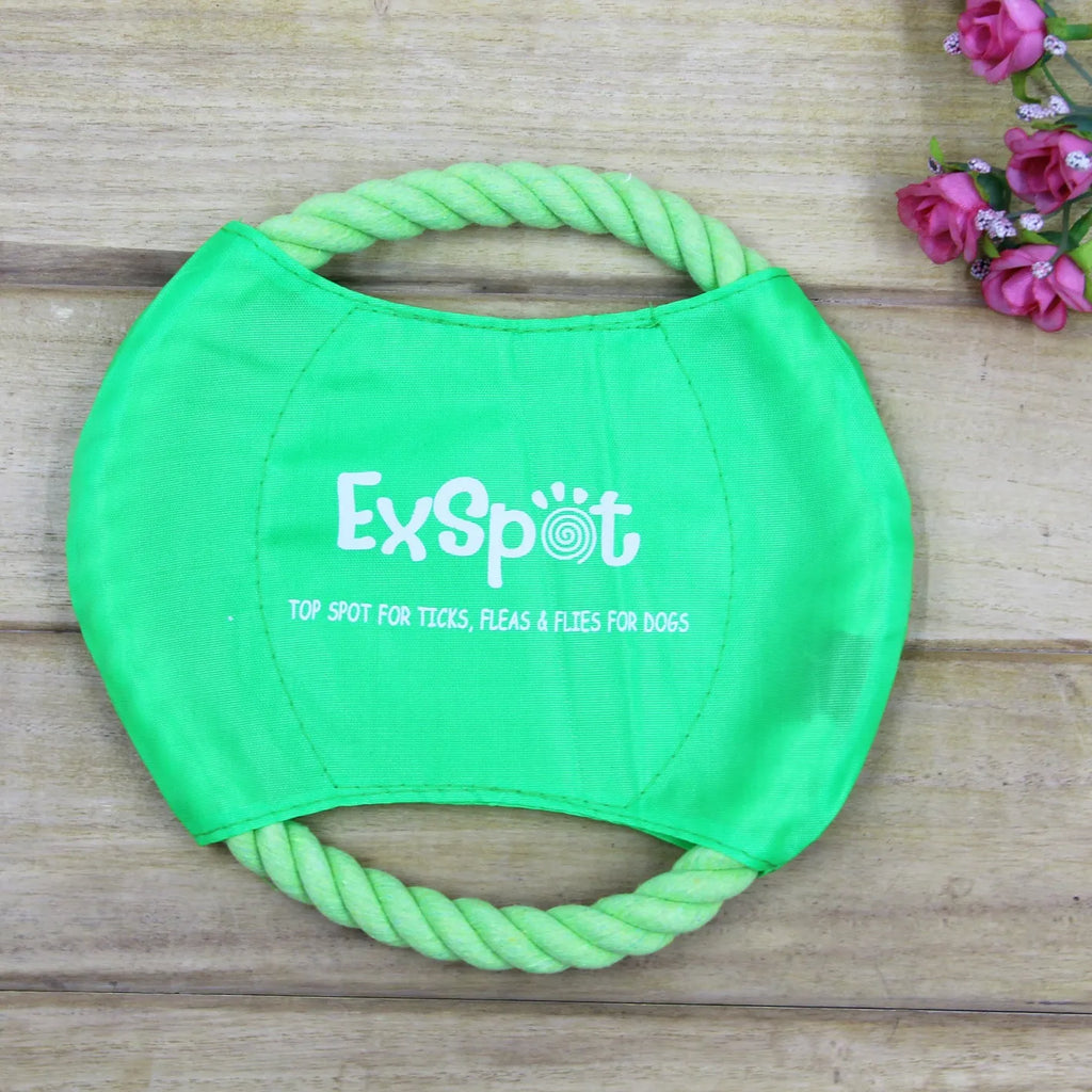 Canvas and rope dog flying disc toy with rain silk surface, 19cm diameter, on grass
