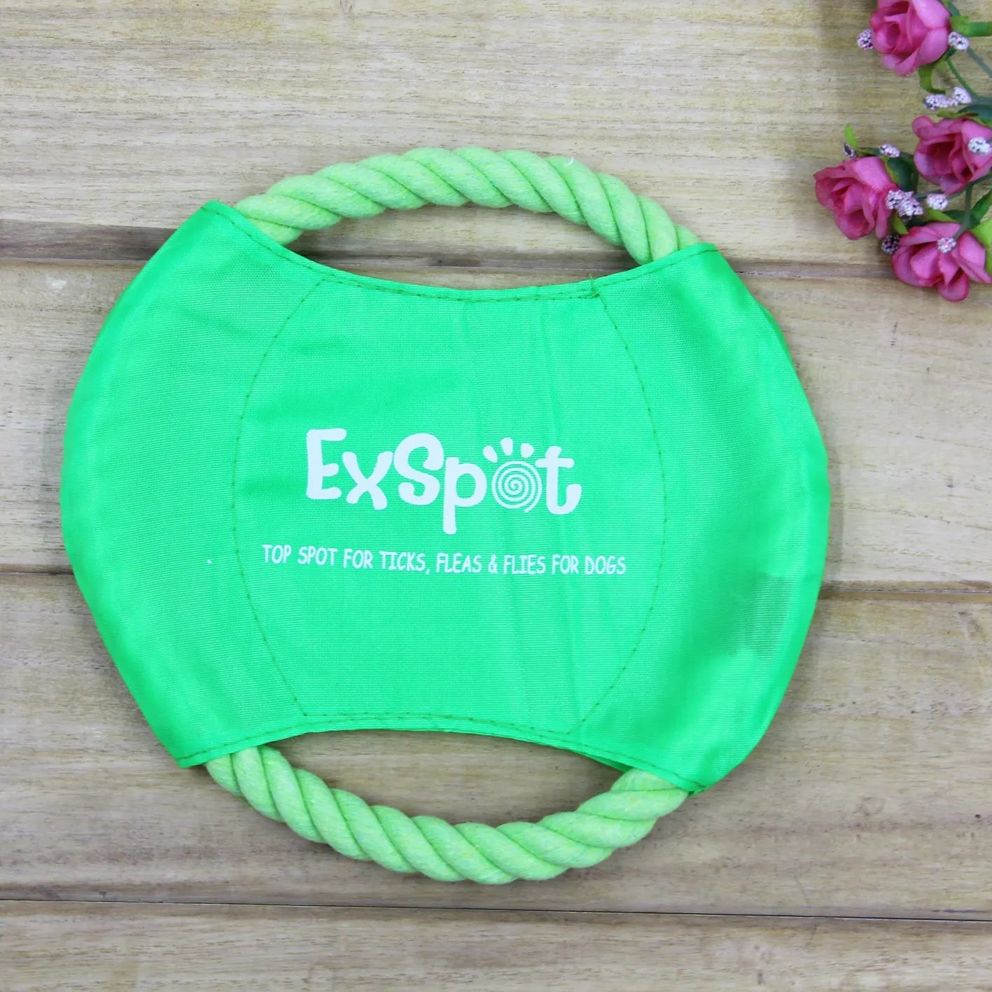 Canvas and rope dog flying disc toy with rain silk surface, 19cm diameter, on grass