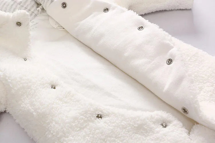 Baby cotton padded winter jumpsuit in marrón colour with long sleeves and feet coverings