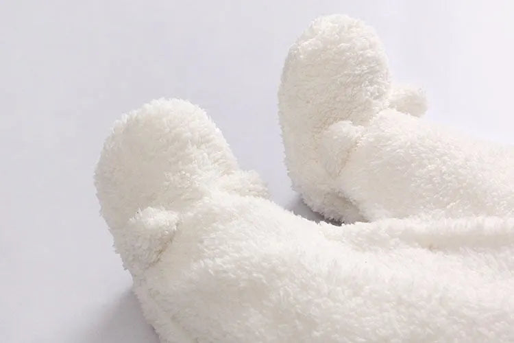 Baby cotton padded winter jumpsuit in marrón colour with long sleeves and feet coverings