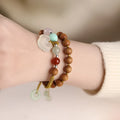 Hand-woven ebony double ring bracelet for women in national style with Ruyi motif.