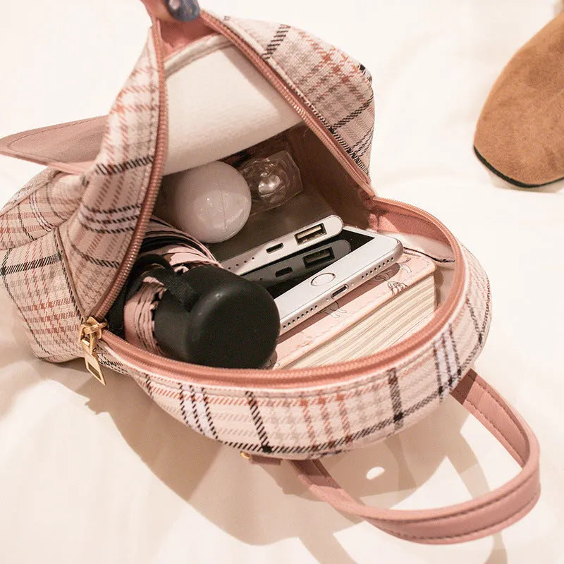 A one shoulder diagonal phone bag made from PU leather, shown in one of five colour options.