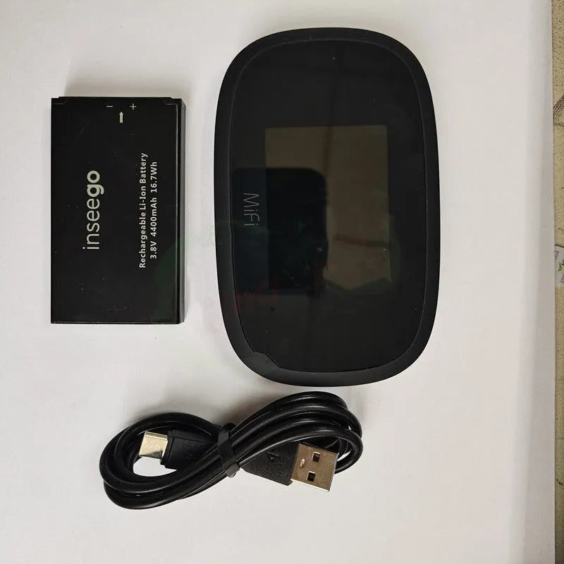 Black Full Network mifi8000 4G portable wireless router with battery and USB cable on a table