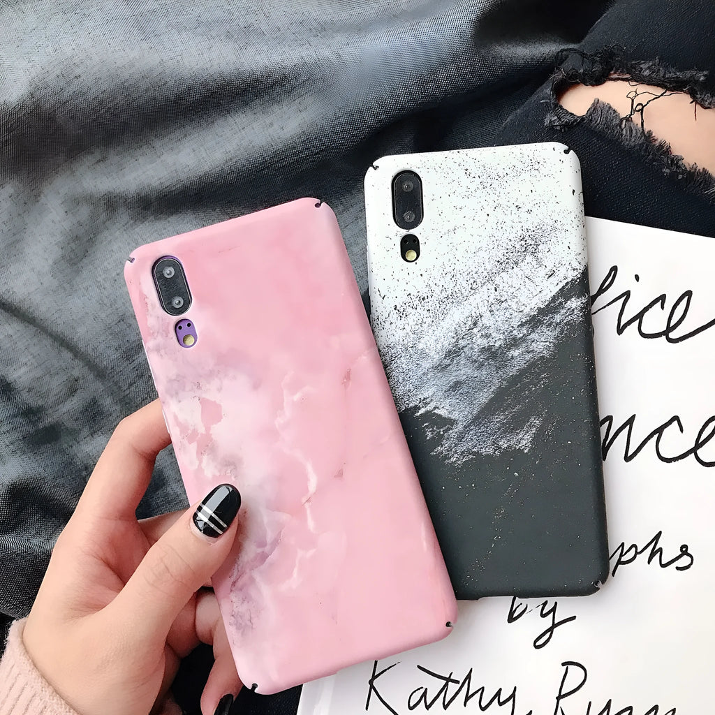Painted pure colour black and pink phone back cover cases for Huawei models on a white background.