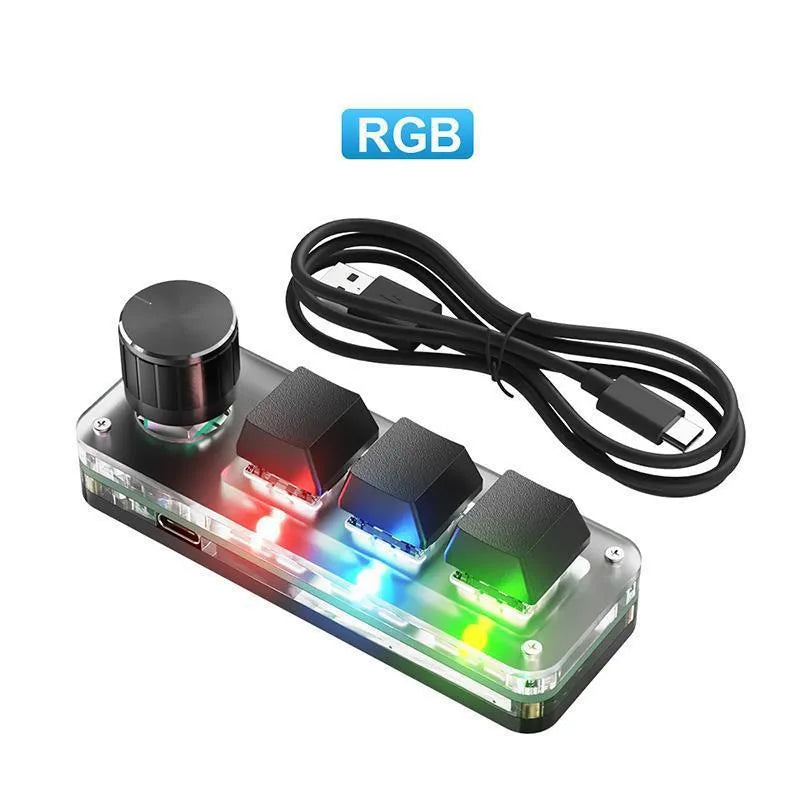 Black and white custom USB macro keyboard with RGB backlighting on a desk