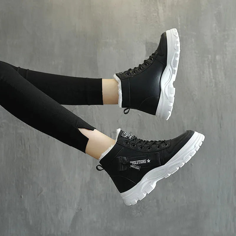 Fleece lace-up boots in black with high-top design, flat heel, and round toe. Artificial PU upper with short plush lining and waterproof platform.