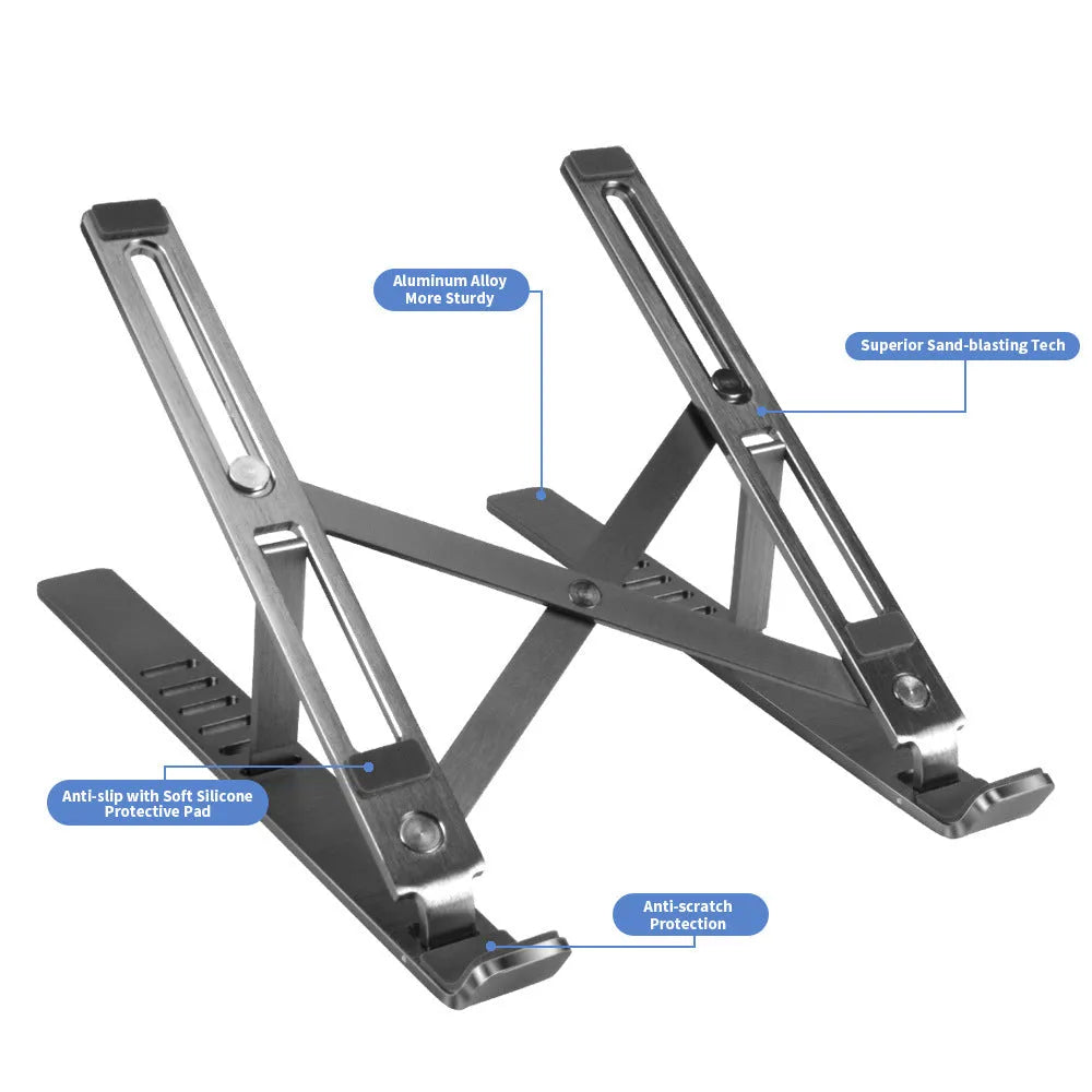 Silver aluminum folding laptop stand shown at an angle on a desk