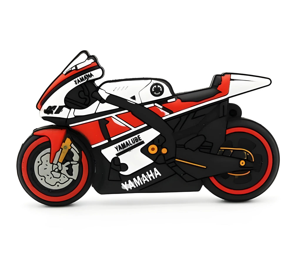 Cartoon motorcycle USB drive with red white wristband and key ring on a surface