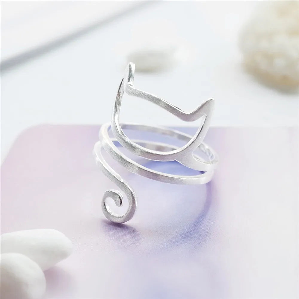 S925 silver adjustable cat ring with brushed winding collar detail on light background