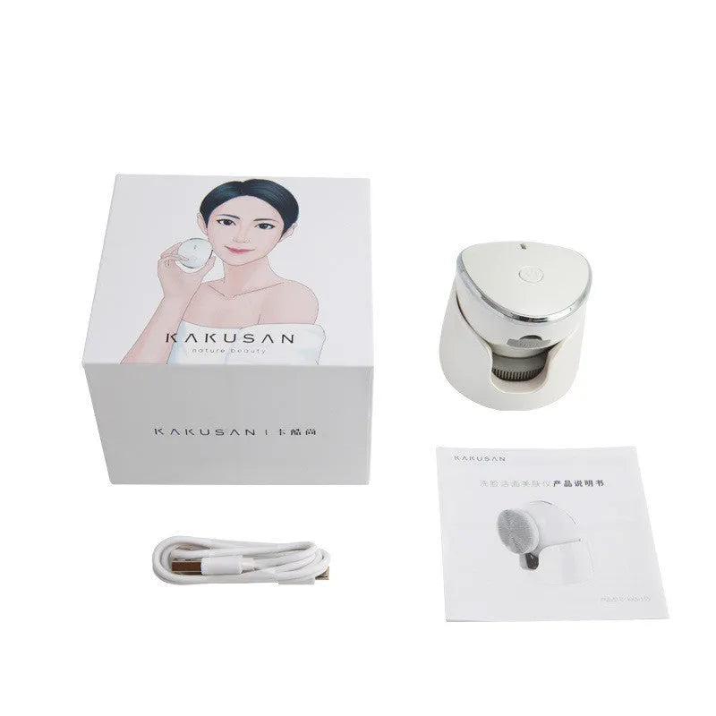 White multifunction USB charging facial cleansing massager with hot egg design, silicone brush head, and 5 vibration modes on a white background