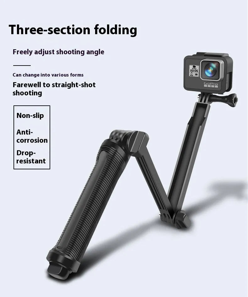 Black portable folding camera tripod stand for GoPro Hero action cameras on a flat surface.