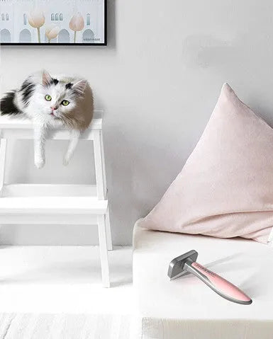 T9 series pet hair removal comb in pink, mint green, and grey on white background