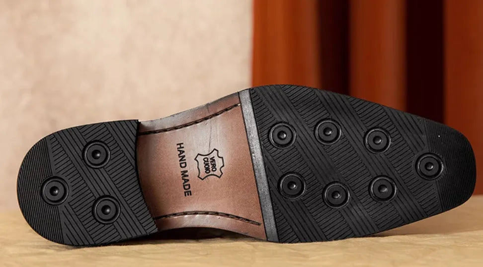 Men's black genuine leather loafers with a fringed detail and slip-on design.