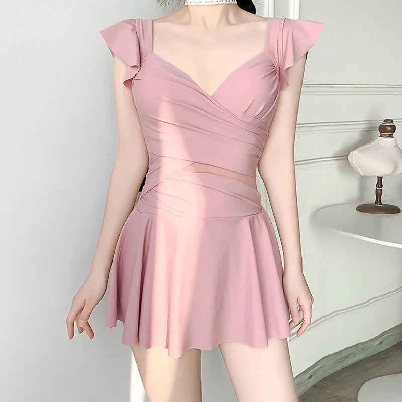 Women's solid colour one-piece swimsuit in milk silk fabric, shown in black, green, and pink.