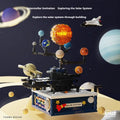 Rotating solar system building block model with plastic small particles for teenagers