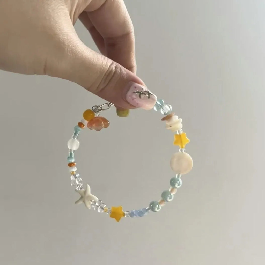 Orange sea theme adjustable alloy bracelet with diamond shape and round decorative elements