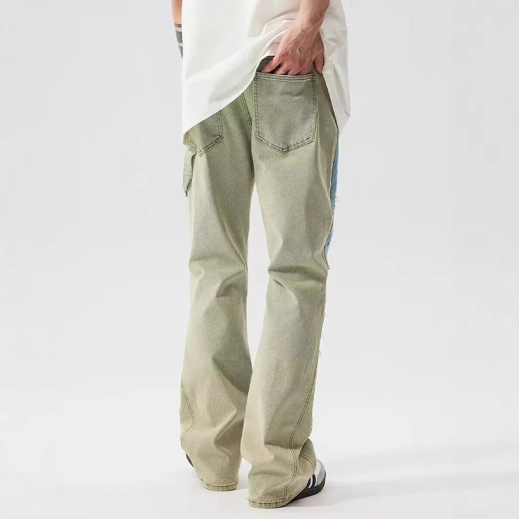 Yellow and blue retro patchwork splash-ink damaged design jeans with a zip fly.