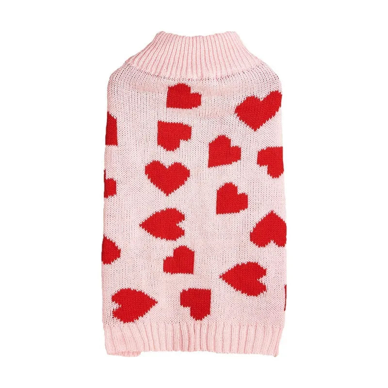 Dog wearing acrylic sweater with embroidered bow and heart patterns