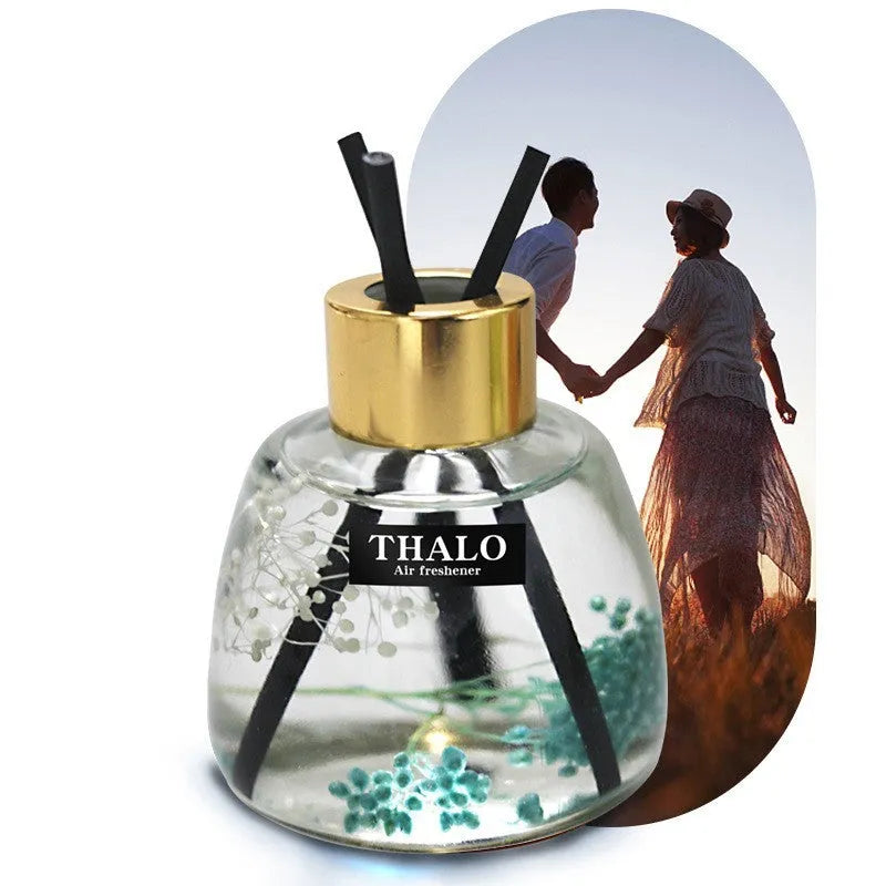 Glass bottle car perfume ornament for vehicle aromatherapy in decorative design.