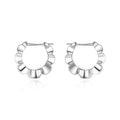 Silver geometric earrings with electroplated finish and circular design elements