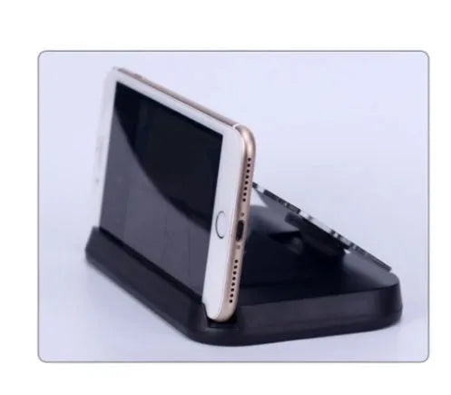 Black mobile navigation bracket with hard tempered glass Head-Up display and suction cup magnet mount on car dashboard