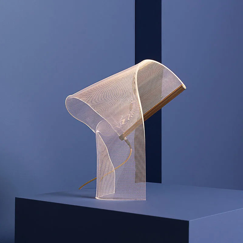 Irregular acrylic ribbon table lamp with warm light on a living room side table