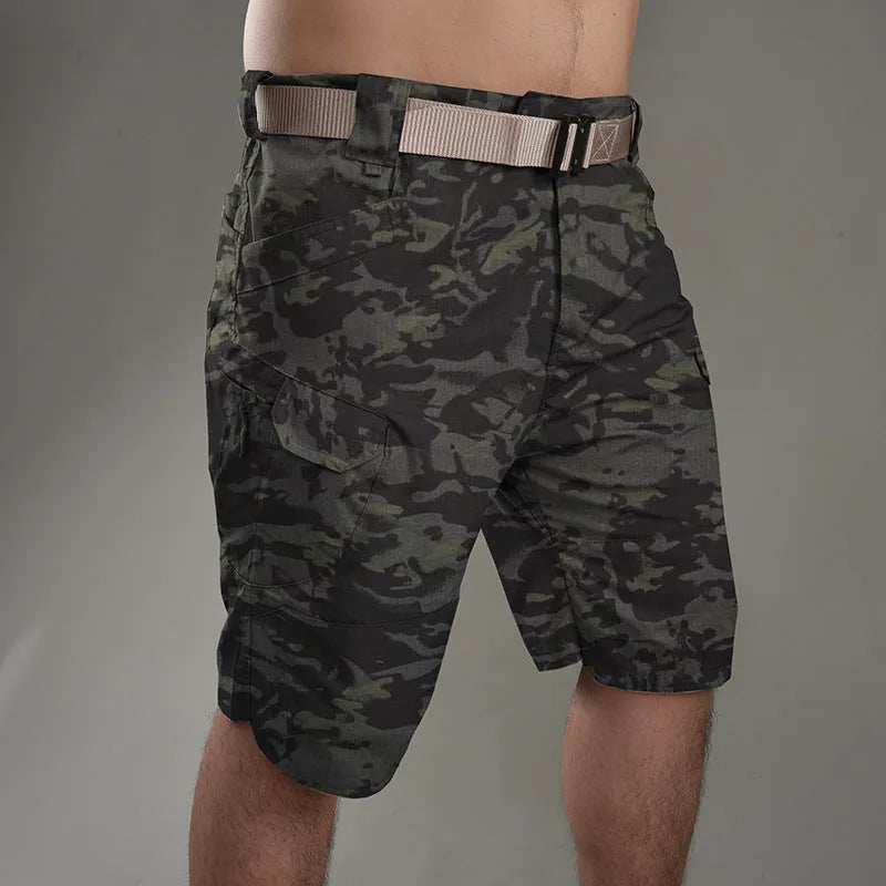Men's khaki tactical shorts with button closure for hiking and outdoor work.