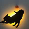 LED cat-shaped night light with sound sensor, warm yellow glow, acrylic shade, wall-mounted in a bedroom