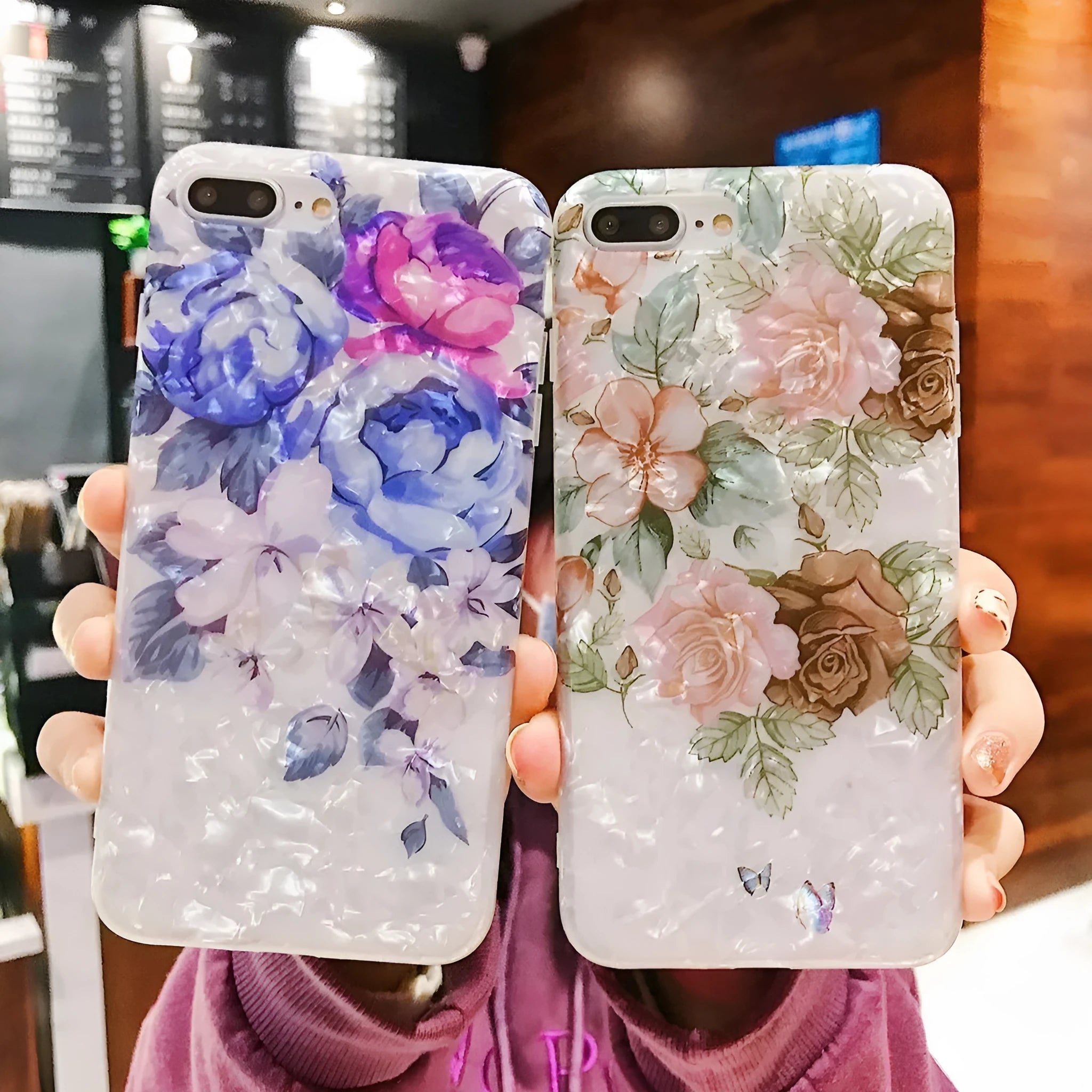 Soft TPU silicone iPhone case with a rose flower design on the back in brown, shown fitted to a phone.