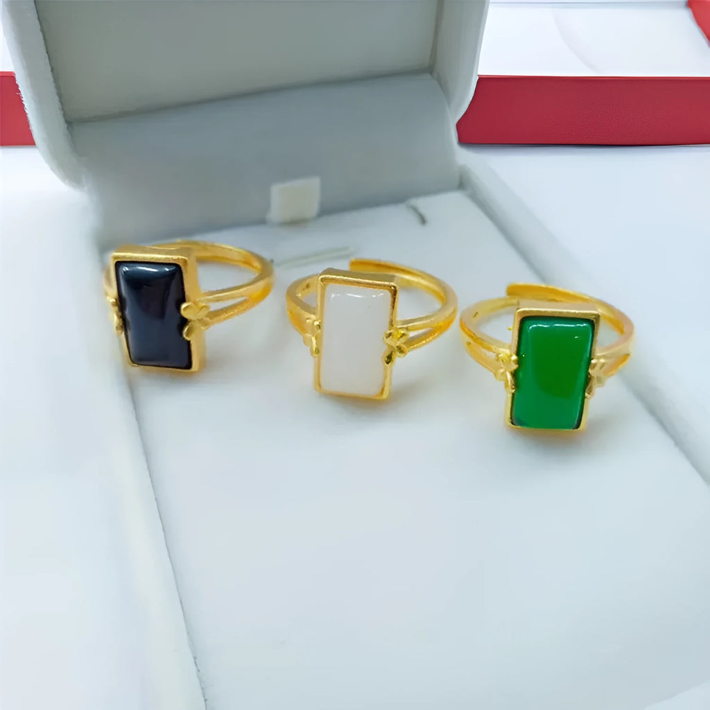 Adjustable brass gold-plated ring with a green gemstone inlay in a national style.