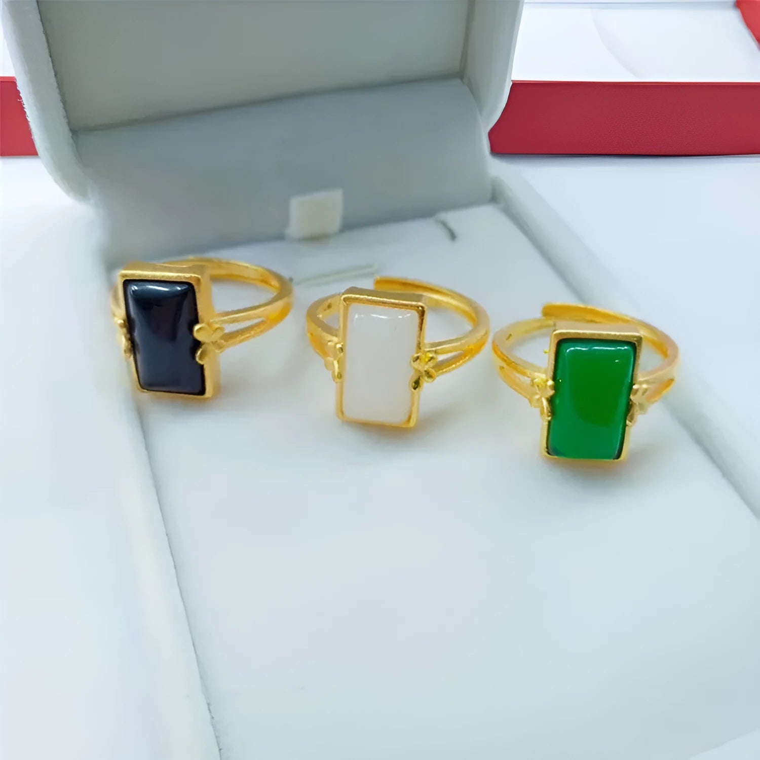 Adjustable brass gold-plated ring with a green gemstone inlay in a national style.
