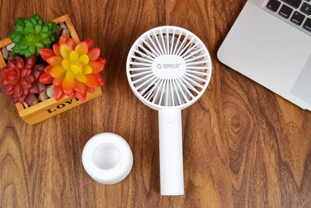 White ORICO FH1 portable USB rechargeable small fan on a desk