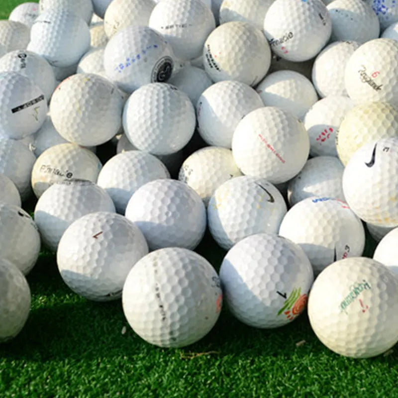 White Golf Next Practice Game Ball with 352 beehive holes and synthetic rubber core, second-hand condition