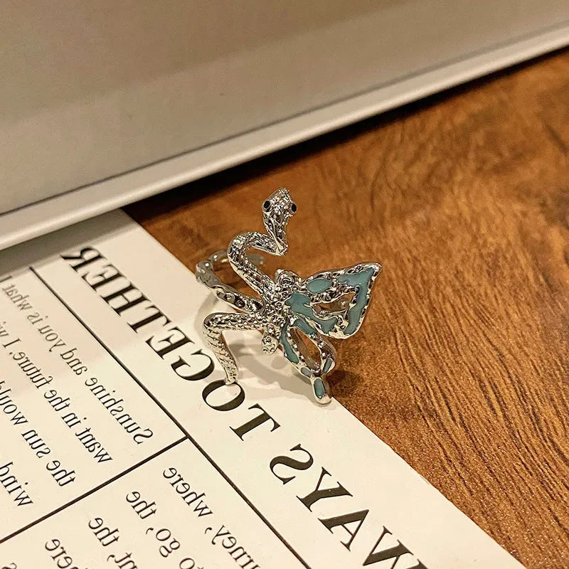 Simple copper women's ring with a Chinese butterfly design, showing an example from the 33 available numbered styles.