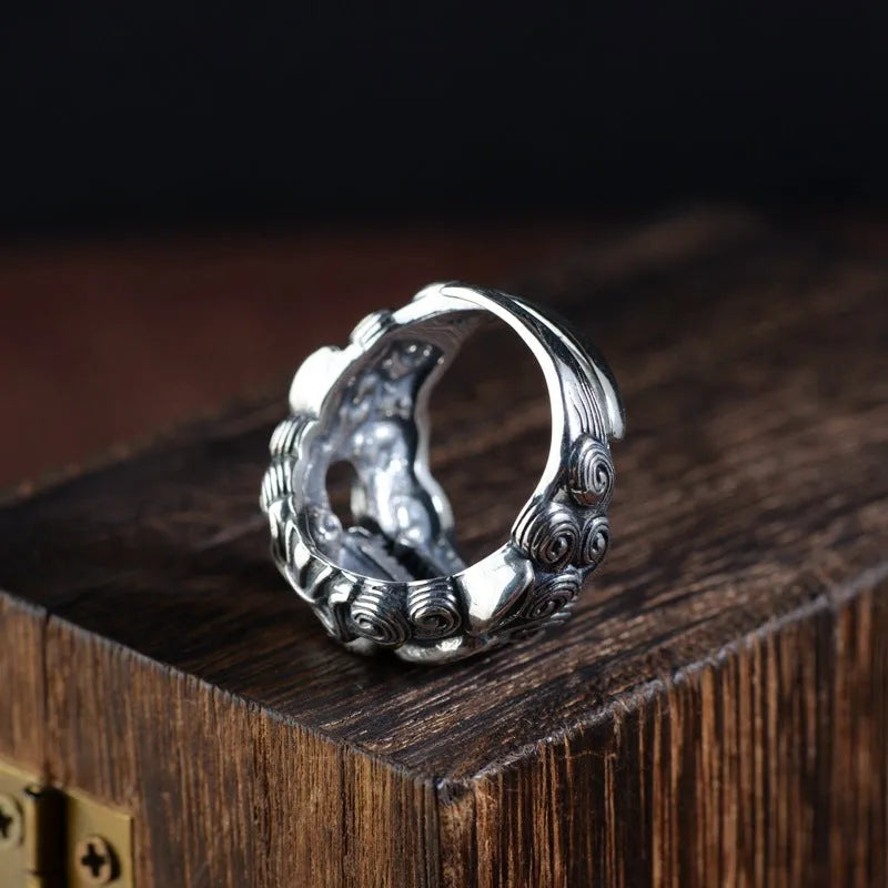 Silver open ring with a detailed Jibeast animal zodiac pattern and diamond design on a white background.